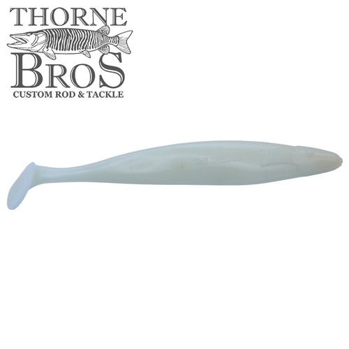 Single soft plastic fishing lure in a translucent glow color with a paddle tail, designed for fishing tackle use, shown for the Action Plastics 12" Dredge Shad (3 Pack).