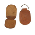 Angler's Image Amadou Fly Dryer made of brown leather with a compact, foldable design, featuring a metal loop for easy attachment and embossed branding on the front.