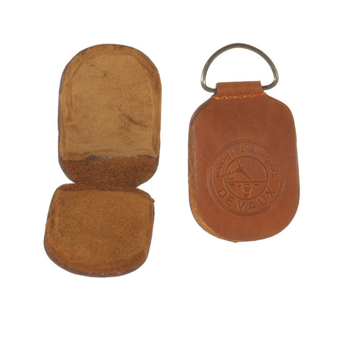 Angler's Image Amadou Fly Dryer made of brown leather with a compact, foldable design, featuring a metal loop for easy attachment and embossed branding on the front.