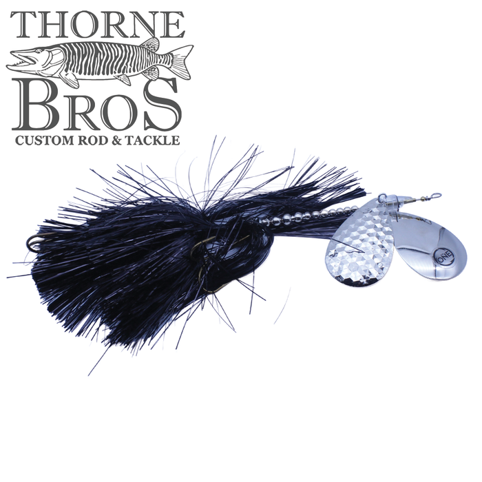 Angling Revolution "The One" 10/10 fishing lure with black skirt and dual silver spinner blades designed for musky fishing, displayed with Thorne Bros logo.