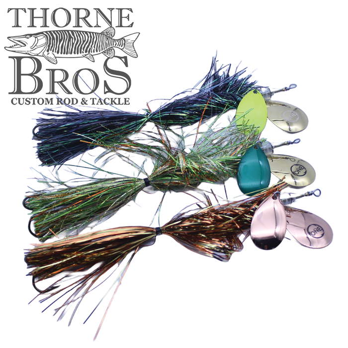Angling Revolution "The One" 8/8 fishing lures in three colors with reflective metal spinner blades and multi-colored synthetic skirt material, designed for musky fishing.