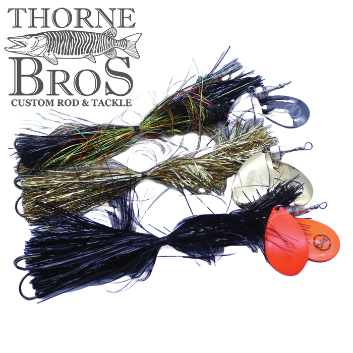 Angling Revolution "The One" 8/9 fishing lure set featuring multiple spinnerbaits with colorful skirts, metal blades, and hooks designed for musky fishing.