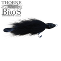 Black fishing lure with a sleek head and furry body, featuring a hook and flexible tail, designed for musky fishing, named Baby Beaver Micro Beaver - Deep.