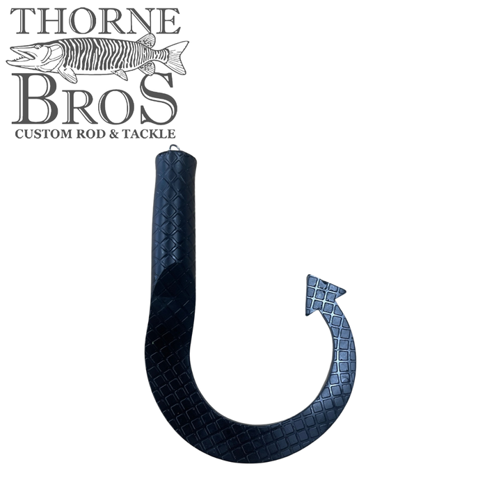 Boss Shad Hybrid Tails black flexible fishing lure tail with textured square pattern, designed for use in fishing tackle and custom musky rods from Thorne Bros.