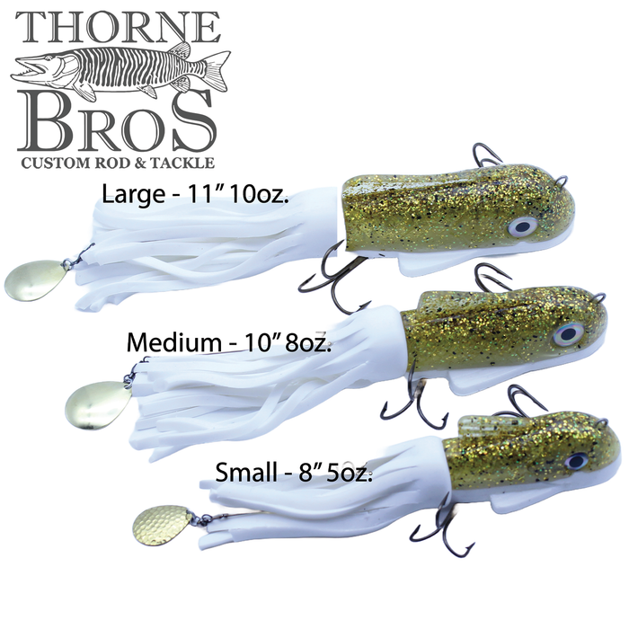 Three sizes of Boss Shad Small Hybrid fishing lures in gold and white with glitter finish and multiple hooks, designed for musky and ice fishing tackle.