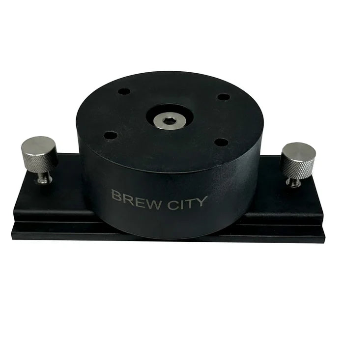Black Brew City LOX360 Shuttle Mount with a circular central body and two silver adjustable knobs on a rectangular base, designed for secure fishing rod attachment.