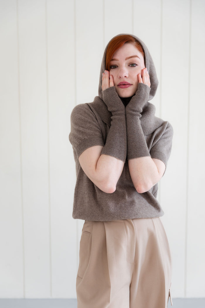 Woman wearing 100% Mongolian cashmere arm warmers, and matching cashmere balaclava, and  cashmere short sleeve top