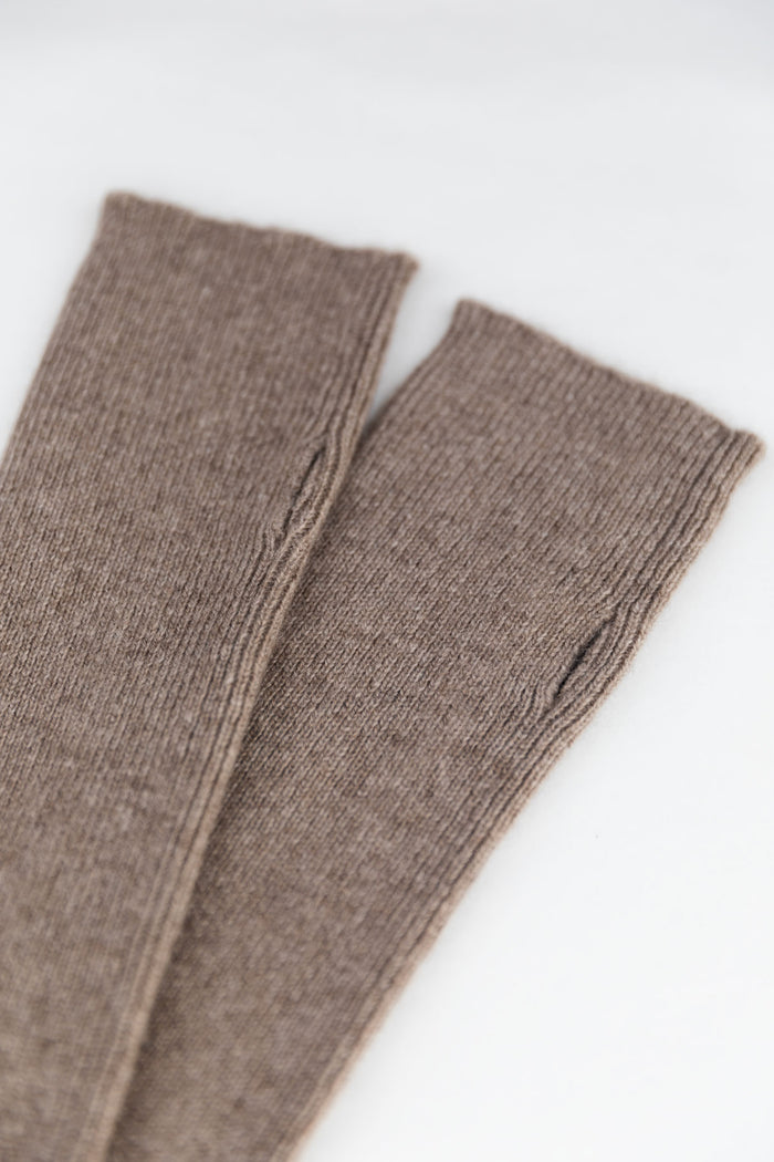 A close-up of 100% Mongolian cashmere arm-warmers in taupe