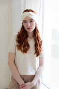 Woman wearing a 100% Mongolian cashmere headband in natural white