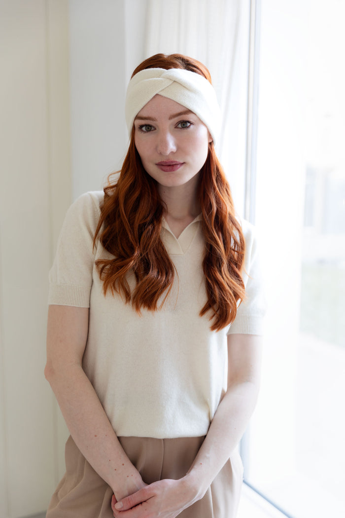 Woman wearing a 100% Mongolian cashmere headband in natural white