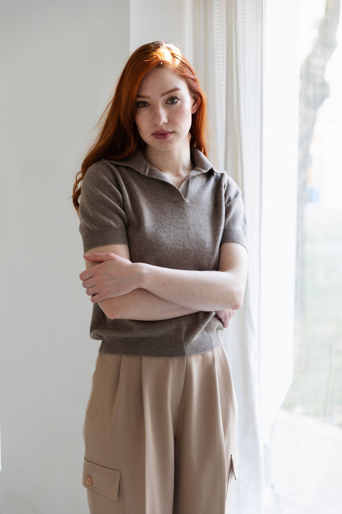 Woman wearing a 100% Mongolian cashmere polo in taupe and beige pants