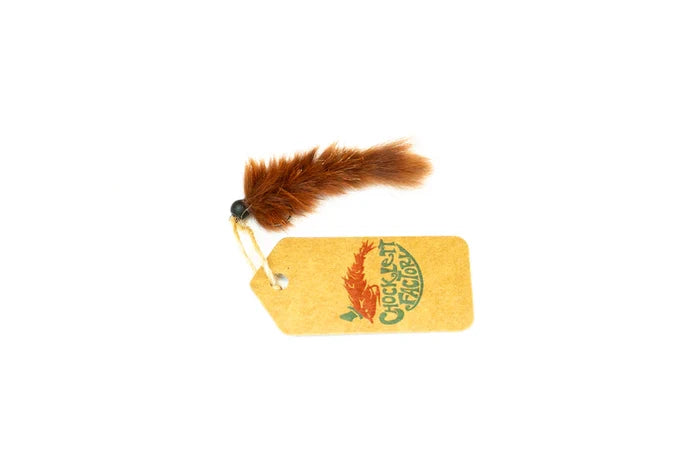 Chocklett Factory Leech Changer fishing lure in rust brown with feathered tail and attached branded tag, designed for fishing tackle enthusiasts.