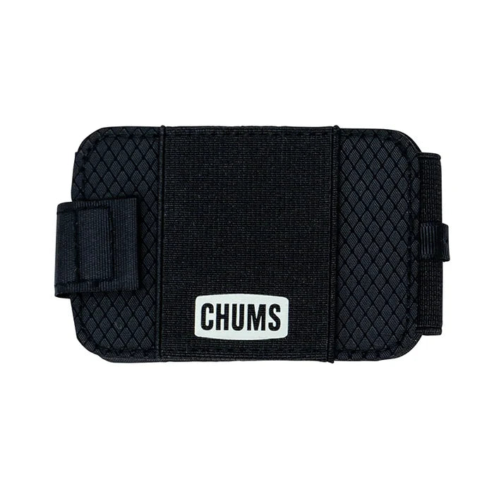 Chums Bandit Bi-Fold Wallet in black with textured exterior and elastic band closure featuring a white logo patch, designed for secure and compact storage.