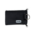 Chums Surfshorts Wallet in black with a textured fabric exterior, dual zipper compartments, and a metal key ring for secure storage and easy access.