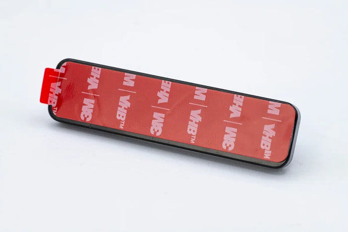 Cling Tool Stick Mini with a rectangular adhesive backing featuring red 3M VHB tape, designed for secure attachment of fishing tackle tools and accessories.