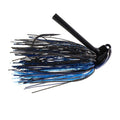 Dirty Jigs JT Kenney Grass Wizard Jig in black and blue with silicone skirt and sharp hook, designed for enhanced fishing tackle performance targeting musky and freshwater fish.