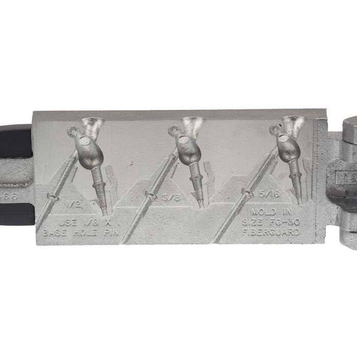 Do-it Molds Casting Jig Mold showing three detailed fishing jig head shapes with measurements and instructions embossed on the metal mold for making custom fishing lures.