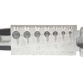Do-it Molds Football Jig Mold showing multiple cavity sizes for shaping fishing jigs, made of metal with detailed sizing and usage instructions embossed for fishing tackle customization.