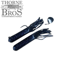 Two dark blue Drop Tine Chunker Tubes fishing lures with glittery specks, featuring multiple flexible skirt strands and one lure with an attached silver spinner blade.