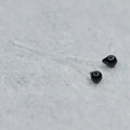 Easy Shrimp Eyes feature small, black, bead-like eyes attached to clear stems, designed for use in custom fishing tackle and lure crafting.