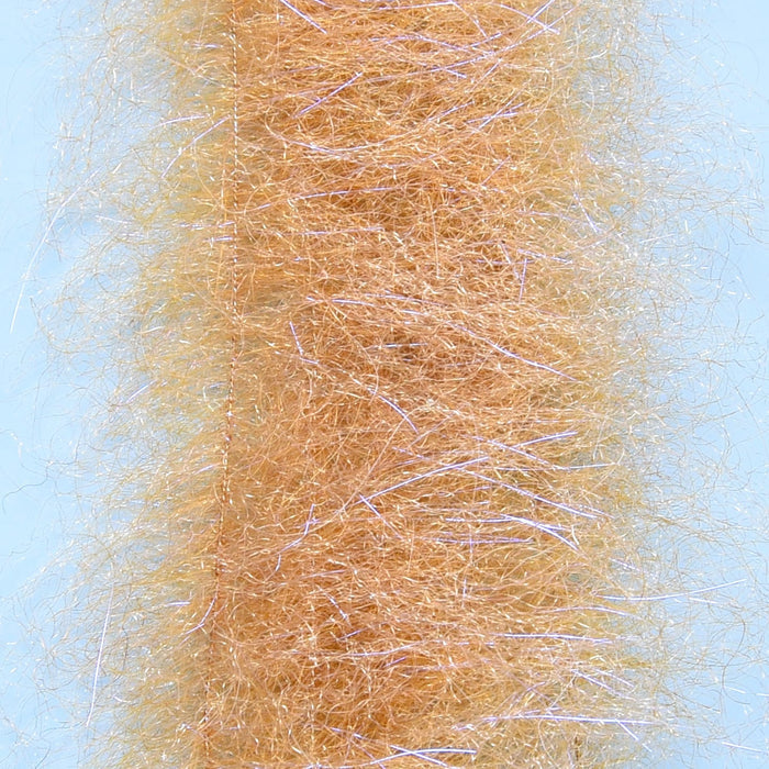 Close-up view of the Enrico Puglisi Shrimp Dub Brush 2 Pack showing light tan synthetic fibers with subtle iridescent strands designed for creating lifelike fishing lures and tackle.