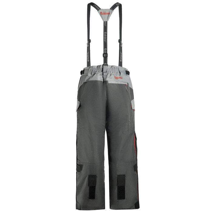 Eskimo Scout Pant - Women's featuring durable gray fabric with adjustable suspenders, reinforced knees, multiple pockets, and a water-resistant design for outdoor fishing activities.