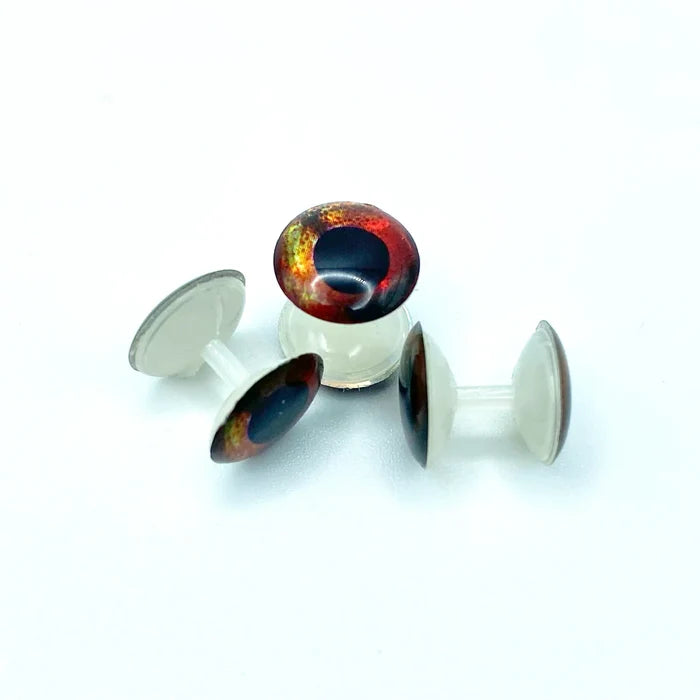 Three small fishing lure eyes with a red and black iridescent finish, each labeled Fish Skull Weightless Living Eyes, designed for fishing tackle and lure customization.