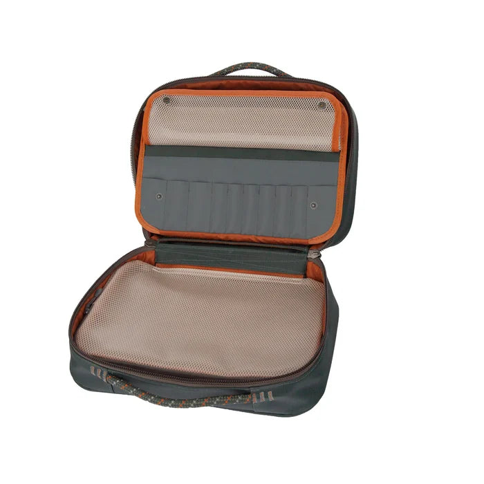Open compact fishing tackle bag with mesh compartments and slots, designed for organizing fly tying materials, shown as part of the Fishpond Backwater Fly Tying Kit.