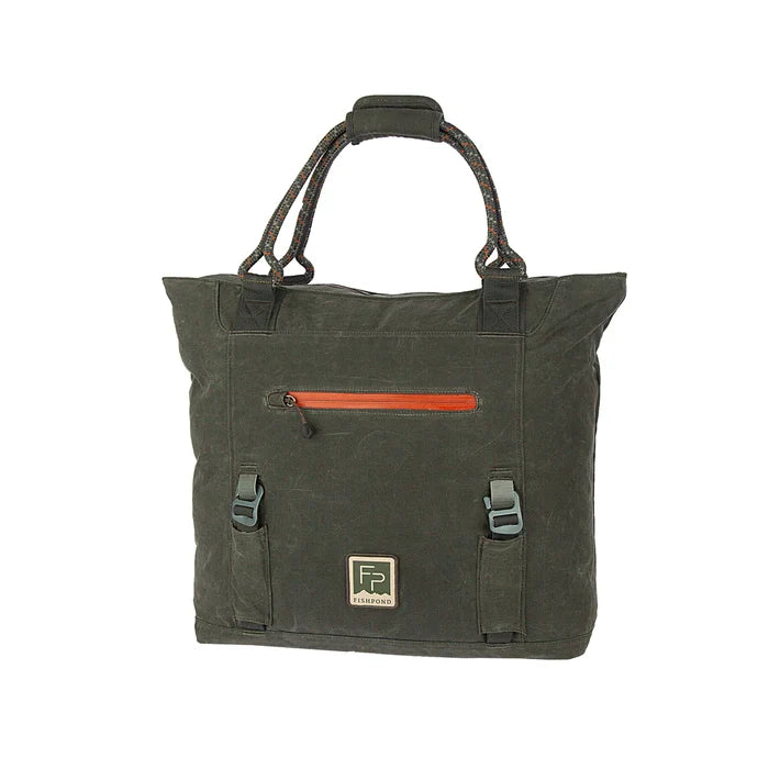 Fishpond Horse Thief Tote in dark olive green canvas with braided rope handles, front zip pocket with orange detail, buckled straps, and Fishpond logo patch.