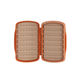 Fishpond Tacky Fly Boxes Silicone in orange, open to show soft silicone interior with multiple rows of slots for securely holding fishing lures and tackle.
