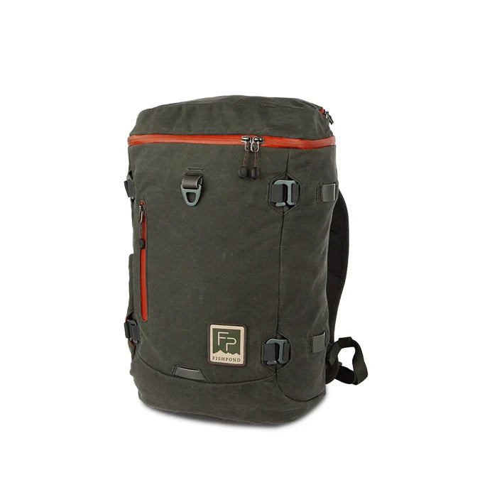 Fishpond River Bank Backpack in dark green with orange zipper accents, featuring multiple exterior pockets, adjustable straps, and a durable fabric designed for fishing tackle and outdoor use.