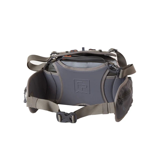 Fishpond Stormshadow Lumbar Pack shown from the back, featuring adjustable padded straps, multiple zippered compartments, and durable water-resistant fabric designed for fishing tackle storage.