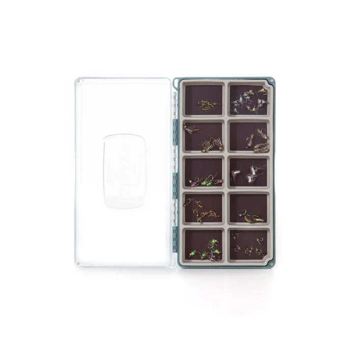 Fishpond Tacky Fly Boxes Silicone displaying organized compartments filled with various fishing flies, designed for secure storage of fishing tackle and gear.