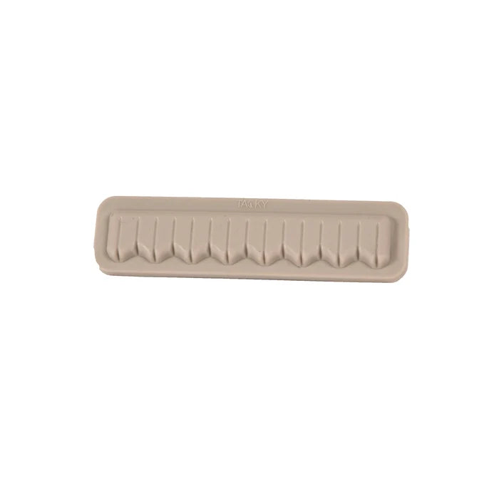 Fishpond Tacky Fly Boxes Silicone Fly Dock in beige with multiple slots designed for securing fishing lures and flies, ideal for organizing fishing tackle.