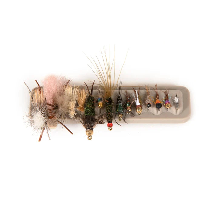 Fishpond Tacky Fly Boxes Silicone Fly Dock holding a variety of colorful, detailed fishing flies with different sizes and feather types for fly fishing tackle organization.