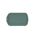 Fishpond Tacky Grande Fly Dock MagPad in muted green, a rectangular soft silicone mat designed for fly fishing with raised edges and embossed logo for secure fly placement and protection.
