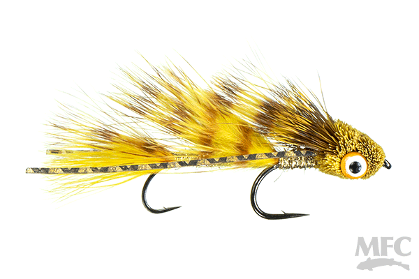 Galloup's Micro Dungeon #10 fly fishing lure featuring yellow and brown feathers, a detailed gold and black head with an eye, and two sharp hooks for musky fishing.
