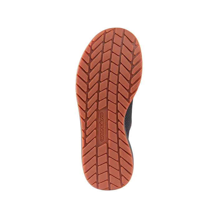 Sole view of the Grundens Keeper Sneaker showing a durable, textured orange-brown tread designed for traction and stability.