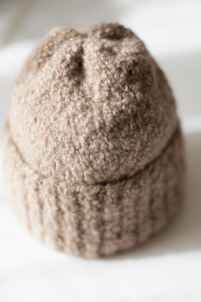 bouclé cashmere knit texture showing softness and artisanal detail