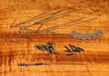 Hareline Bling Tail Connector Kit showing metal wires, swivels, small black tubing, and flexible plastic pieces arranged on a wooden surface, used for fishing tackle assembly.