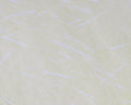 Close-up view of pale, shimmery synthetic fibers with subtle iridescent strands designed for fishing tackle, specifically Hareline Ice Dub Shimmer Fringe material.