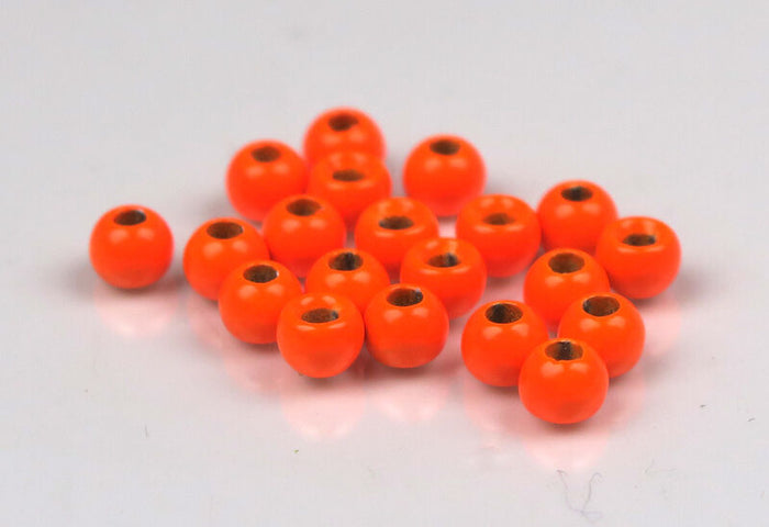 Hareline Plummeting Tungsten Beads Pianted (Non-Slotted) in bright orange, used as fishing tackle components for customizing musky and ice fishing rods.
