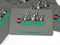 Hareline Silicone Bead Pad with a textured gray surface, featuring cartoon rabbit heads and the Hareline logo in green and red, ideal for organizing fishing tackle and lures.