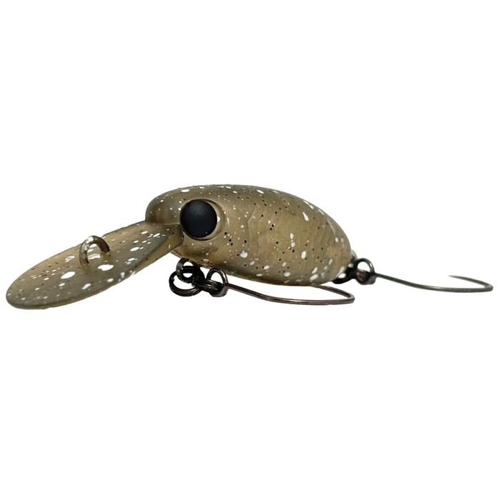 Close-up of a fishing lure with a speckled olive green body, large black eye, clear diving lip, and two sharp hooks, identified as the HMKL Inch Crank MR.