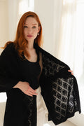 Woman wearing a 100% Mongolian cashmere lace shawl.