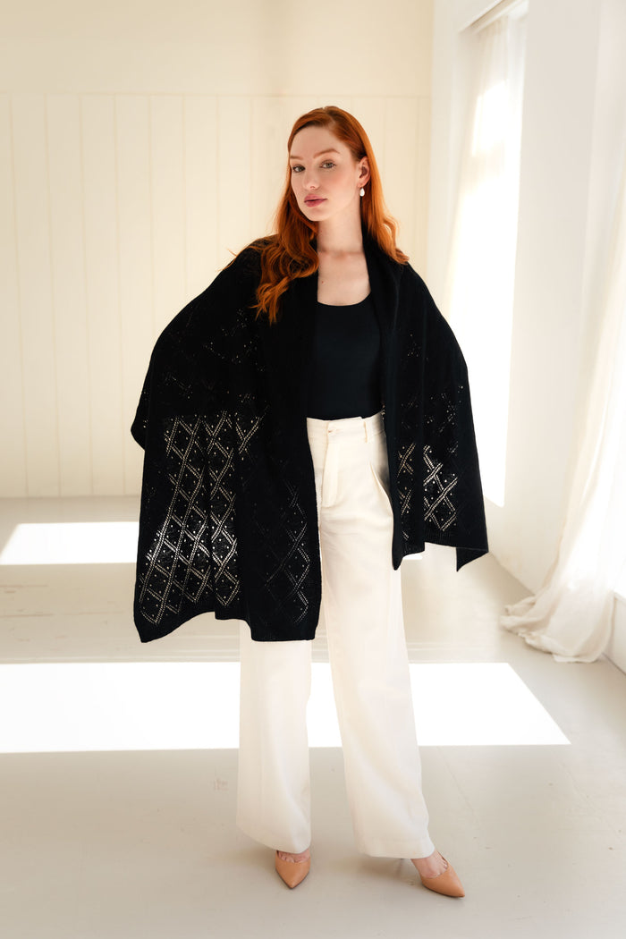 Woman wearing a 100% Mongolian cashmere pointelle shawl.