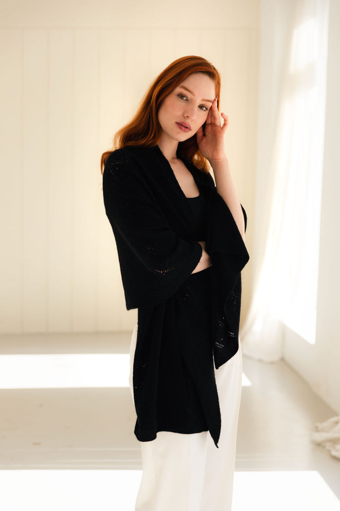 Woman wearing a 100% Mongolian cashmere black shawl.