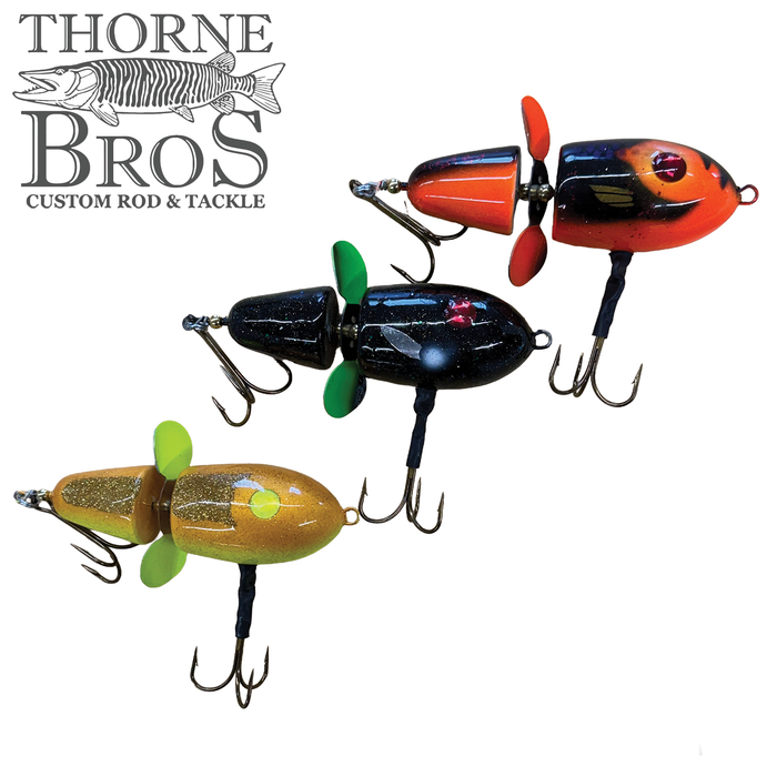 Three colorful Lake-X Hammer fishing lures with propeller attachments and treble hooks, displayed alongside the Thorne Bros logo for custom rod and tackle.