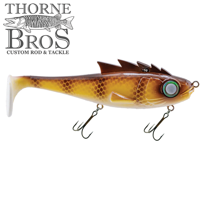 Livingston Lures Mustang fishing lure with a realistic brown and yellow scaled body, detailed fins, large green eye, and two sharp treble hooks designed for musky fishing.
