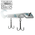 Livingston Lures Titan fishing lure in white and silver with realistic blue eye detail, featuring two sharp treble hooks and a curved tail for lifelike movement.